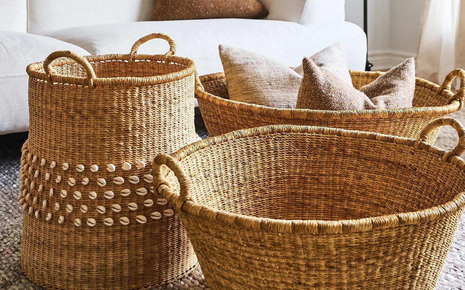 three woven baskets in a living room